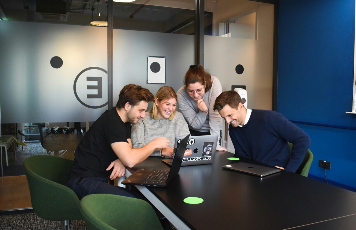 Modern office team collaborating on game development